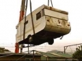 caravan on crane